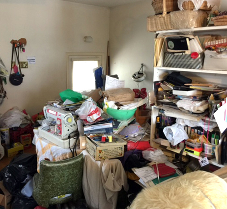 Image Hoarding with image of cluttered room